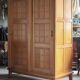 Vintage wooden wardrobe with sliding doors