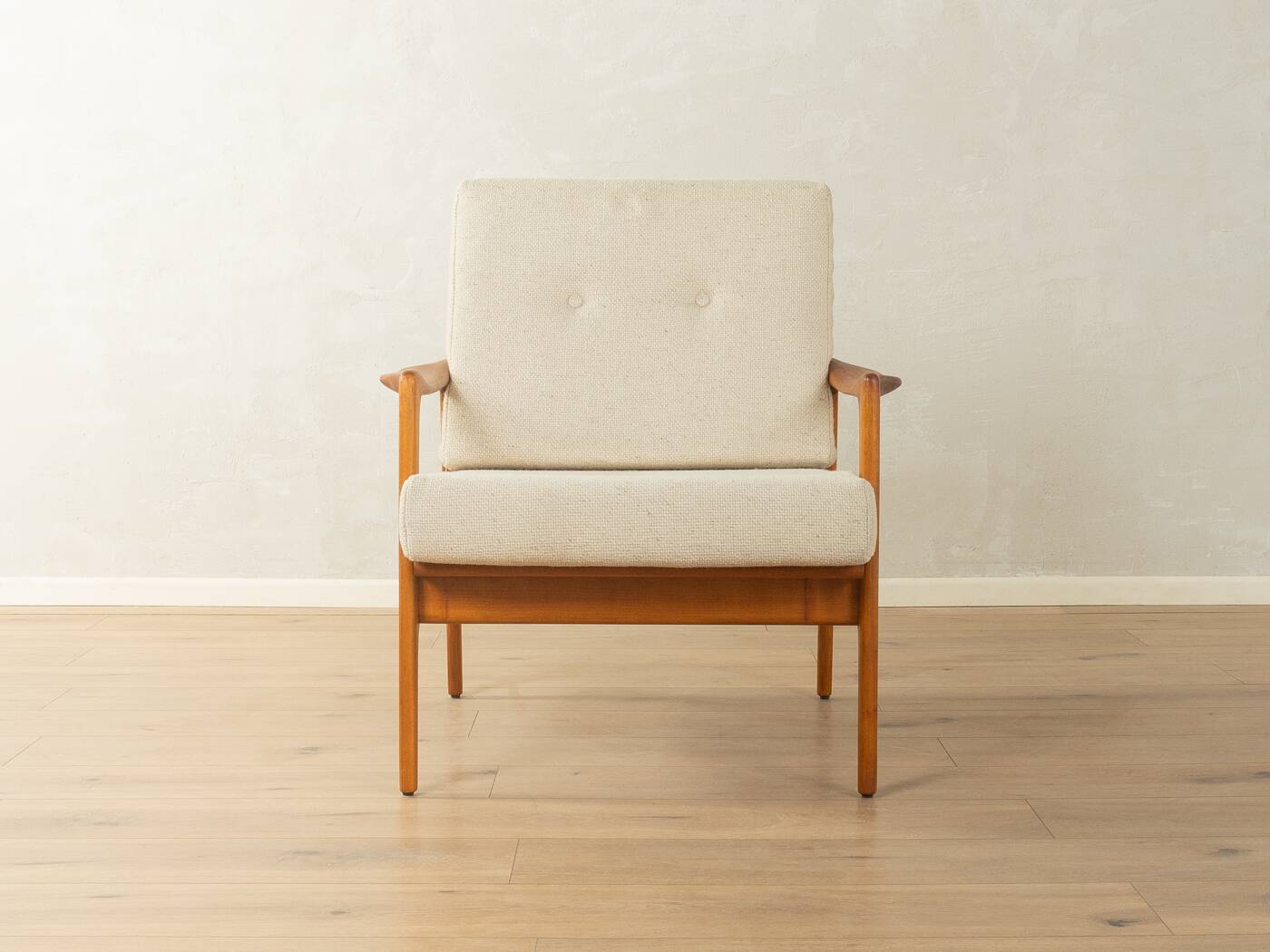 Elegant mid-century armchair from the 1960s with cream-white upholstery