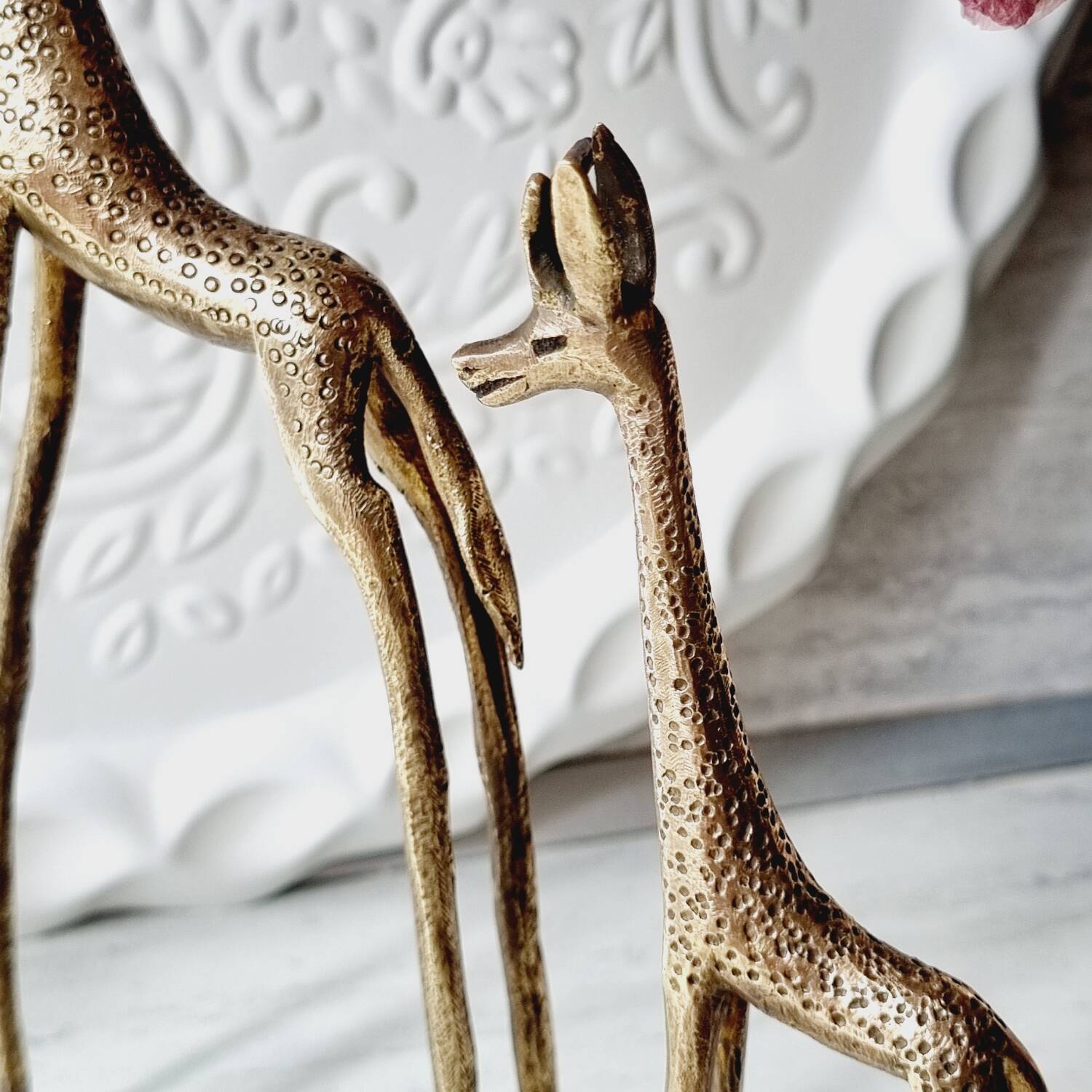 Stylized brass giraffes