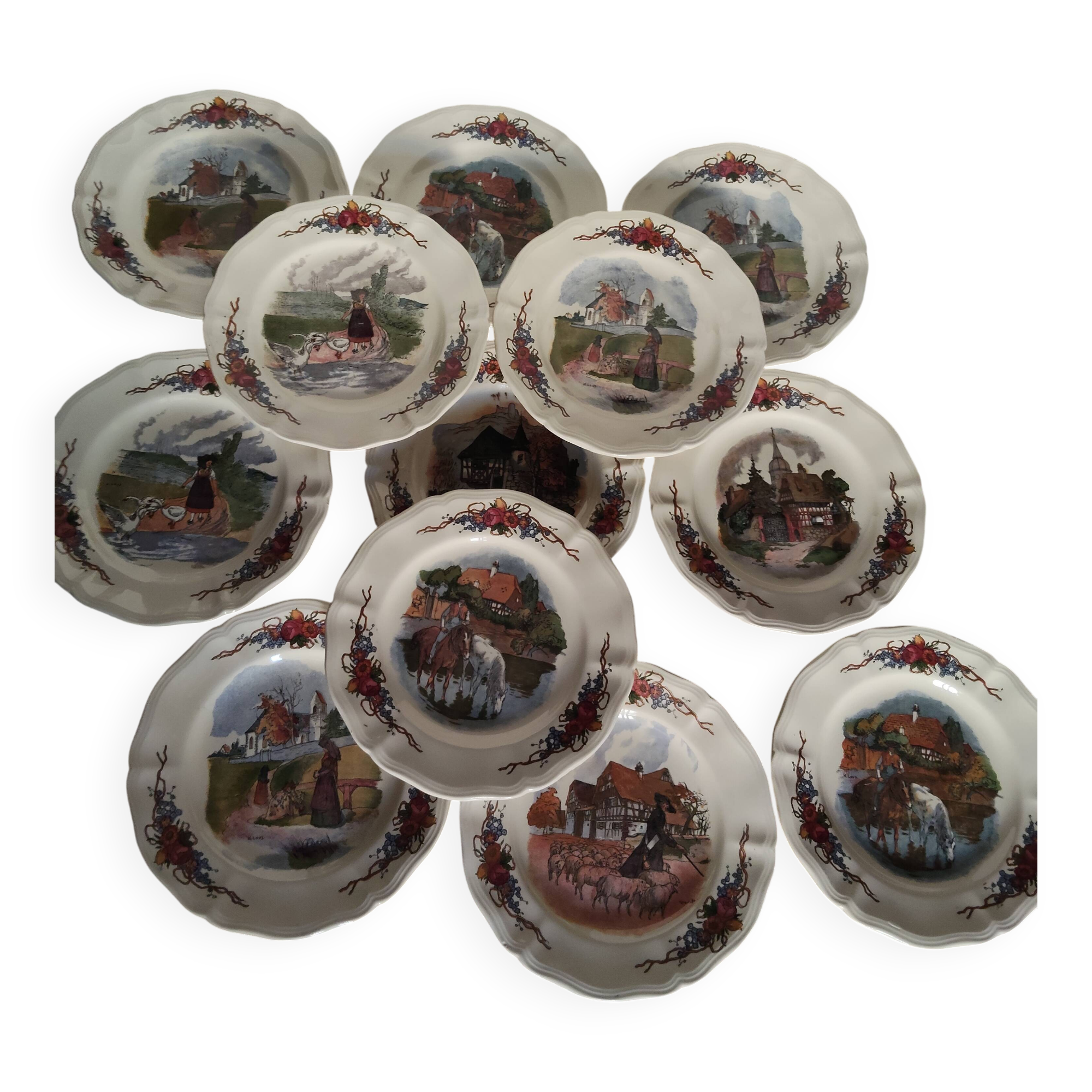 Set of 12 earthenware plates signed Obernai Sarreguemines.