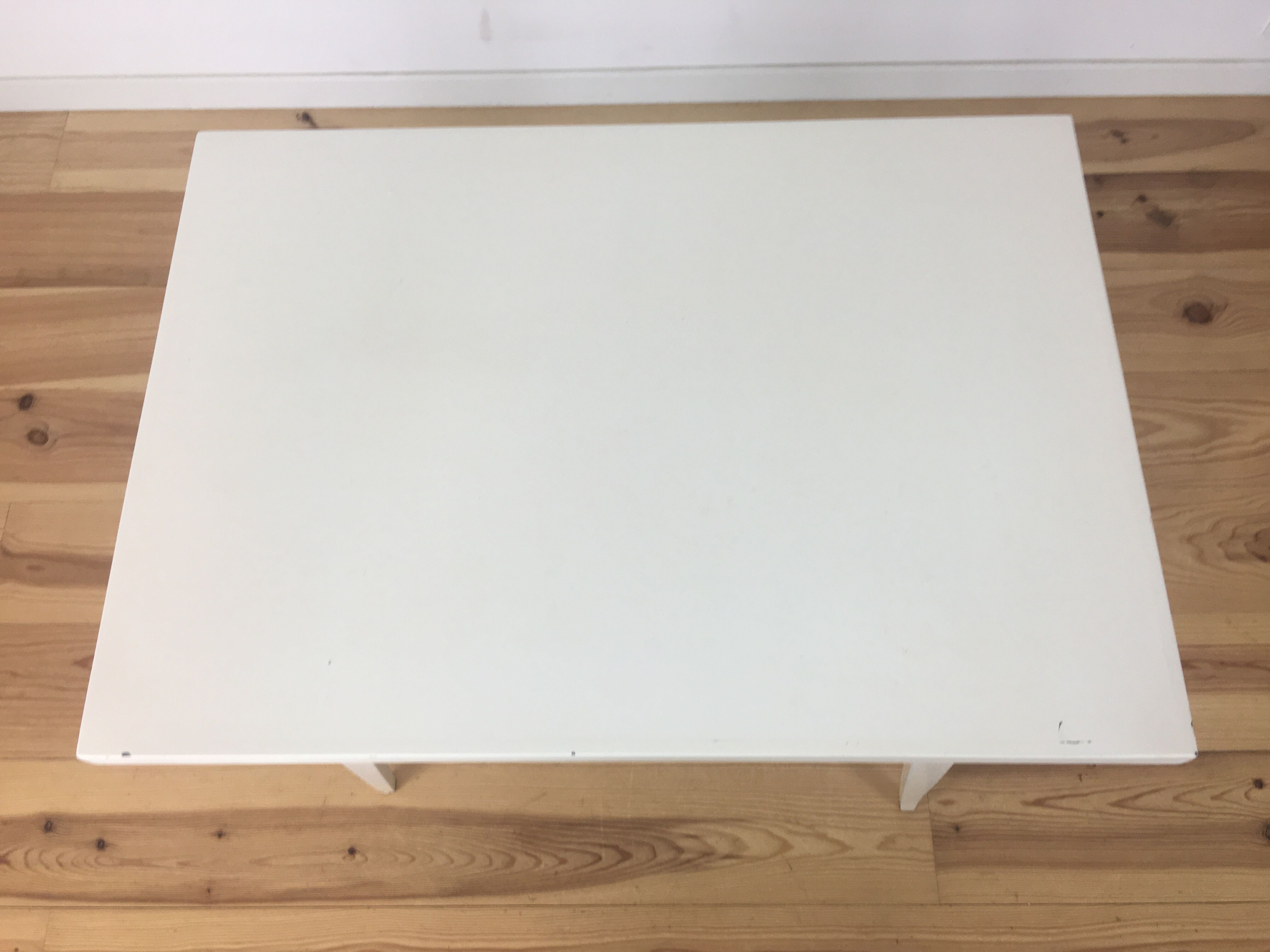 White wood desk foot compass