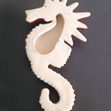 Two vintage ceramic wall pots featuring a seahorse and a starfish.