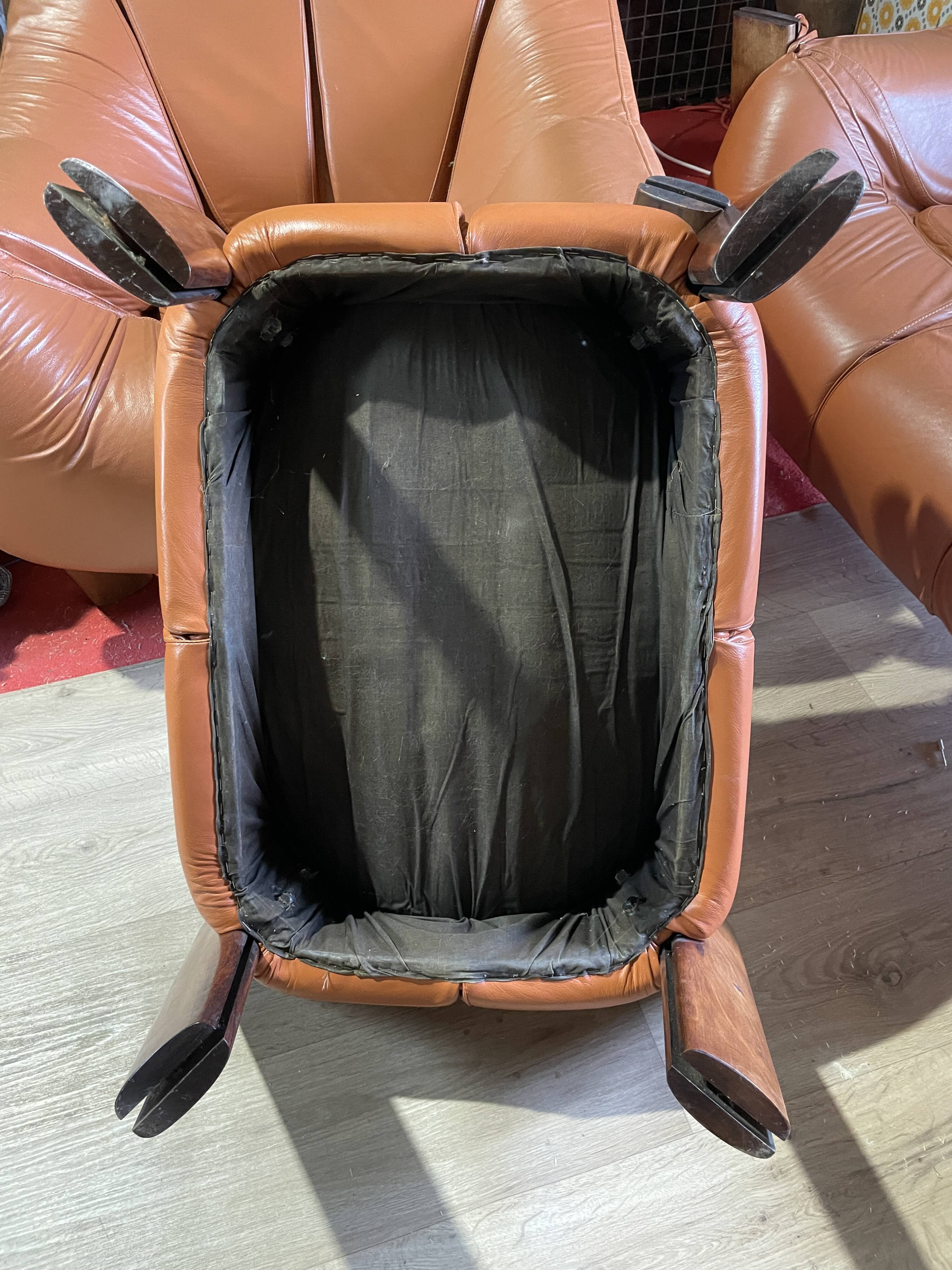 Percival lafer mp-211 sofa set with two armchairs and an ottoman in leather.