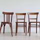 Mismatched wooden bistro chairs