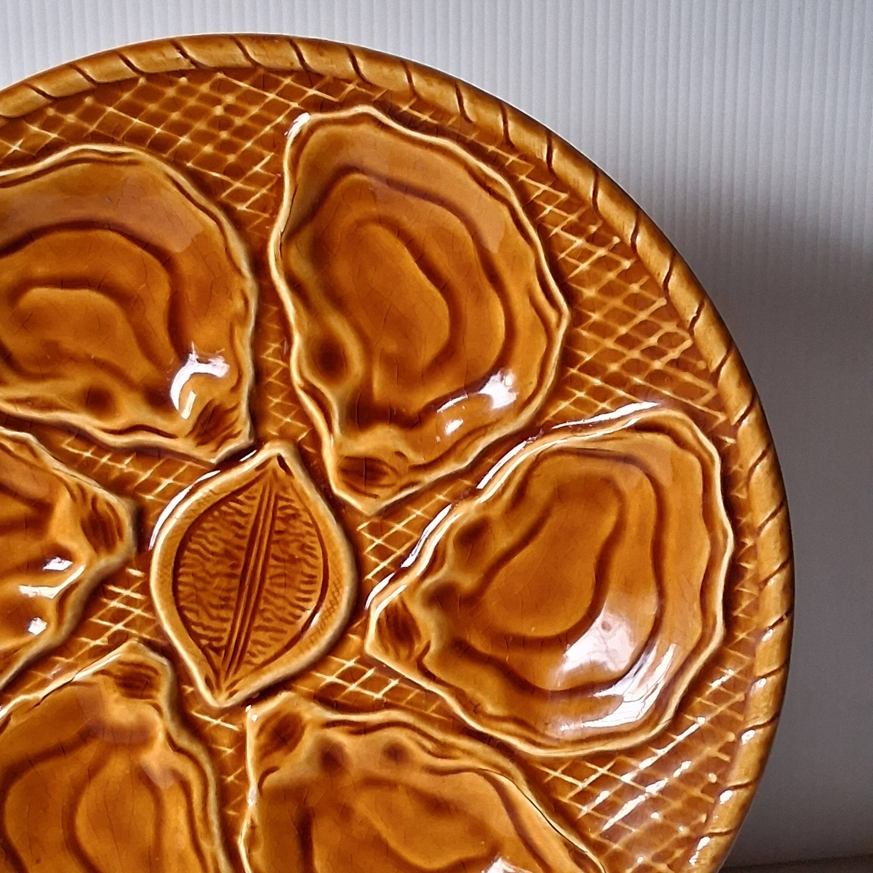 5 oyster or brown shell plates in good condition