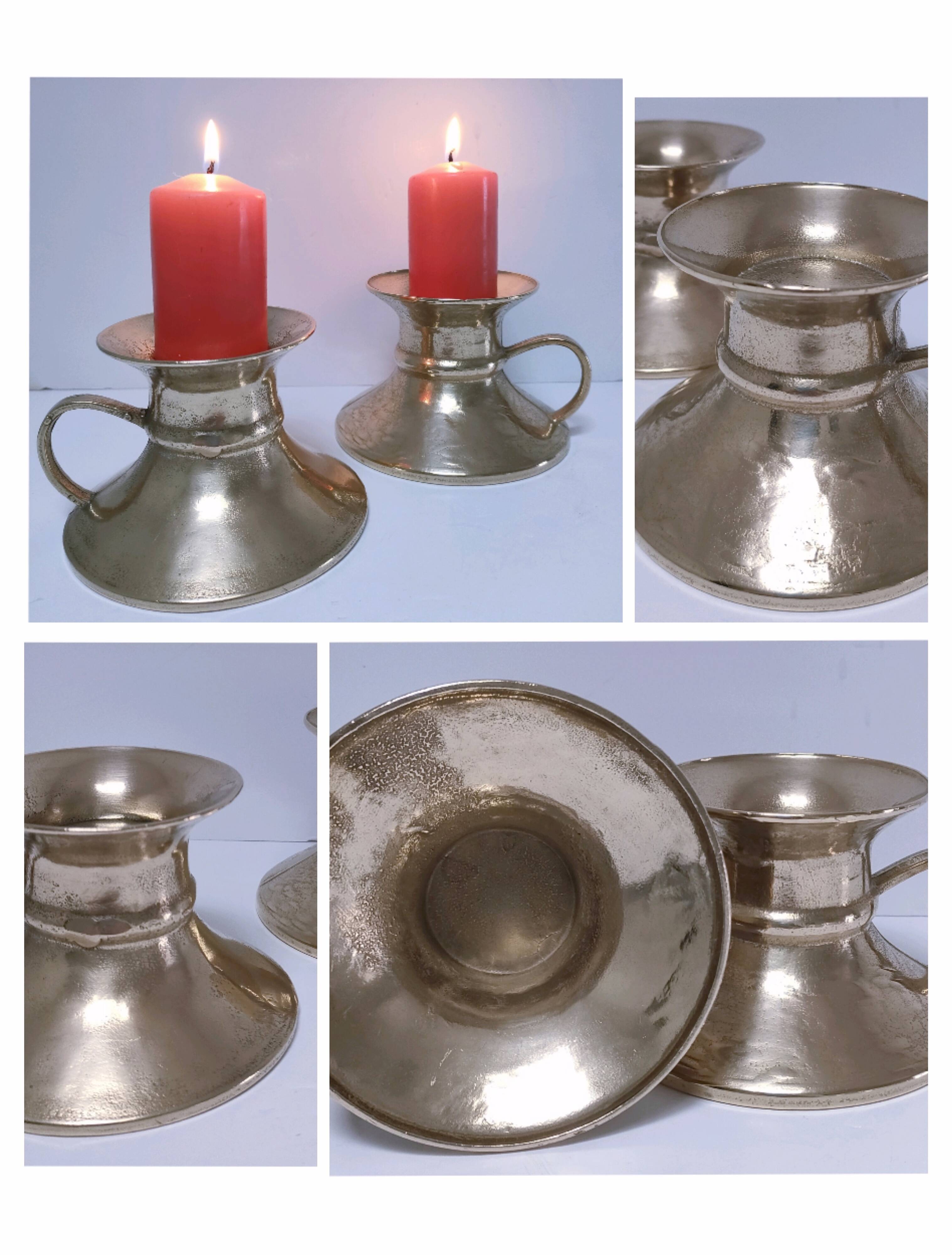 Pair of vintage solid brass hand candlesticks
