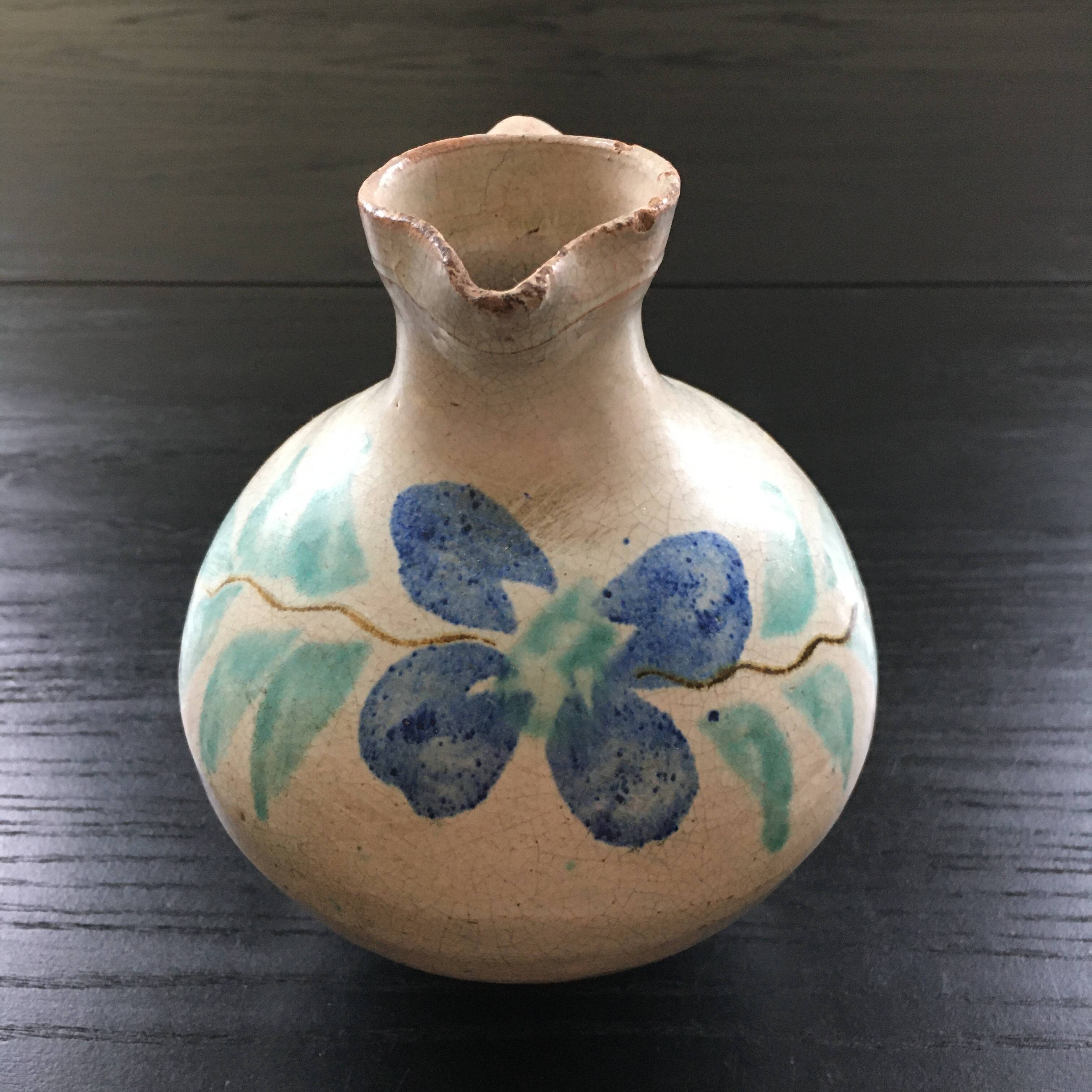 Antique pitcher with floral decoration