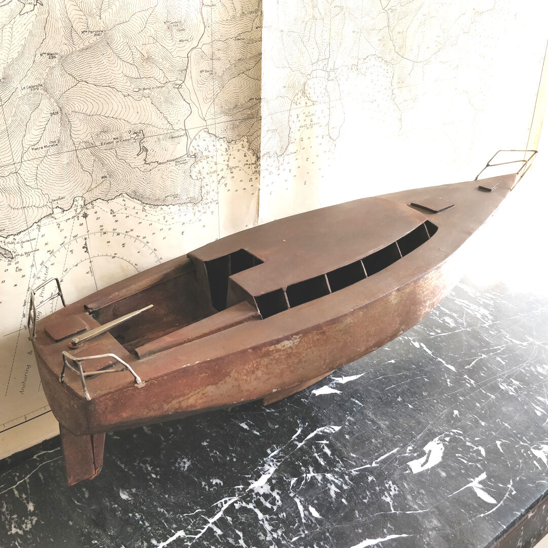 Vintage boat model in patinated metal