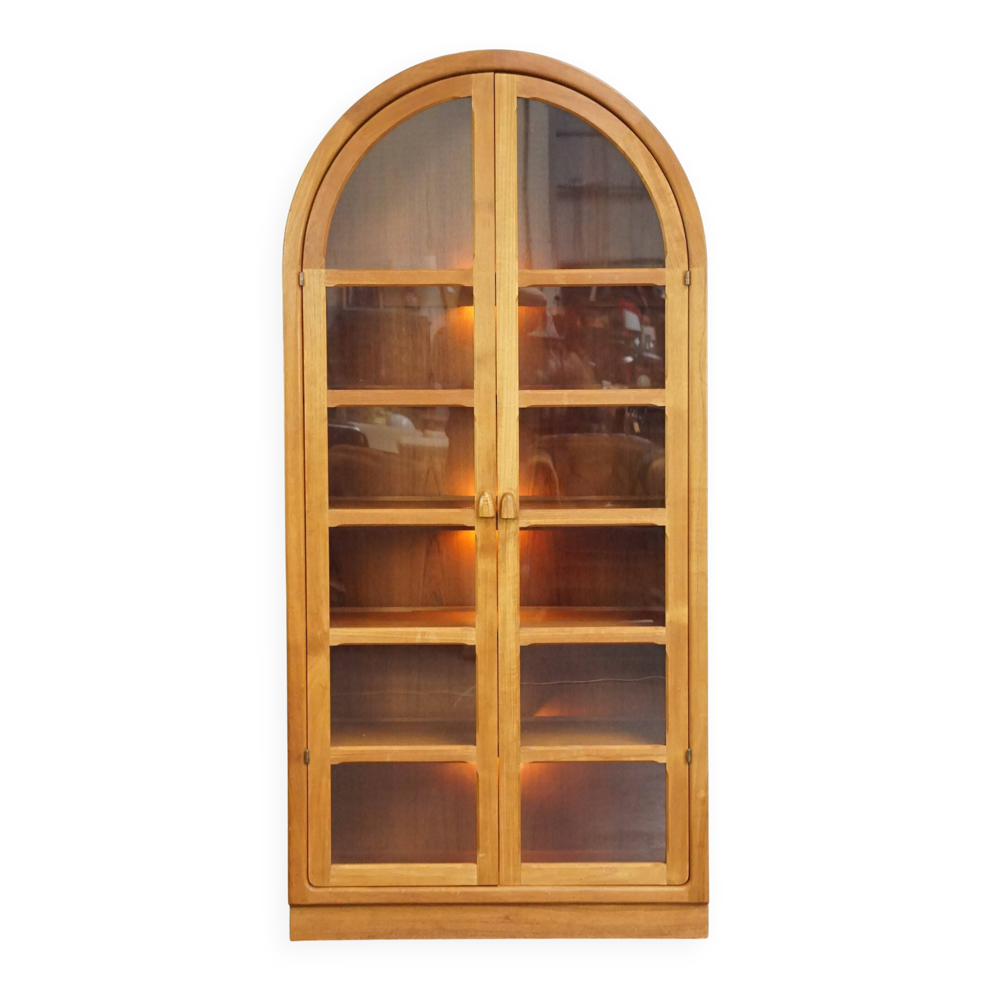 Elegant vintage Danish display cabinet with glass panels and atmospheric lighting