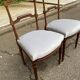 2 Louis XVI period chairs in solid wood and grey fabric.