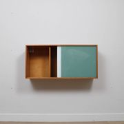A vintage mid century wall hung bookcase/cabinet with glass sliding doors