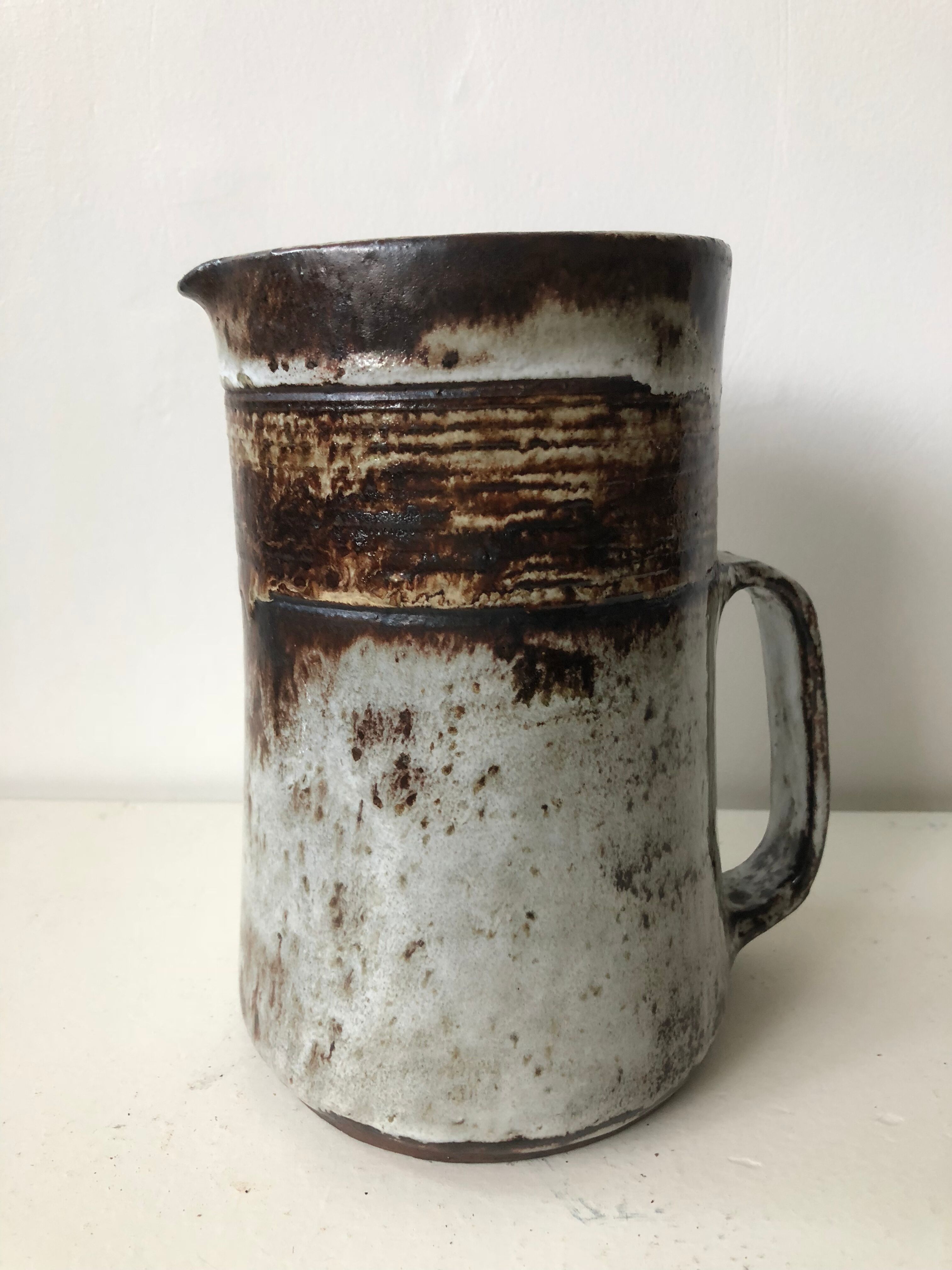 Brown grey enamelled stoneware pitcher