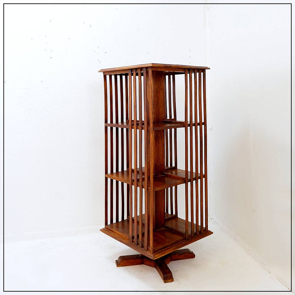 Rotating library on three levels with a central cruciform base.