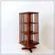 Rotating library on three levels with a central cruciform base.