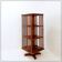 Rotating library on three levels with a central cruciform base.
