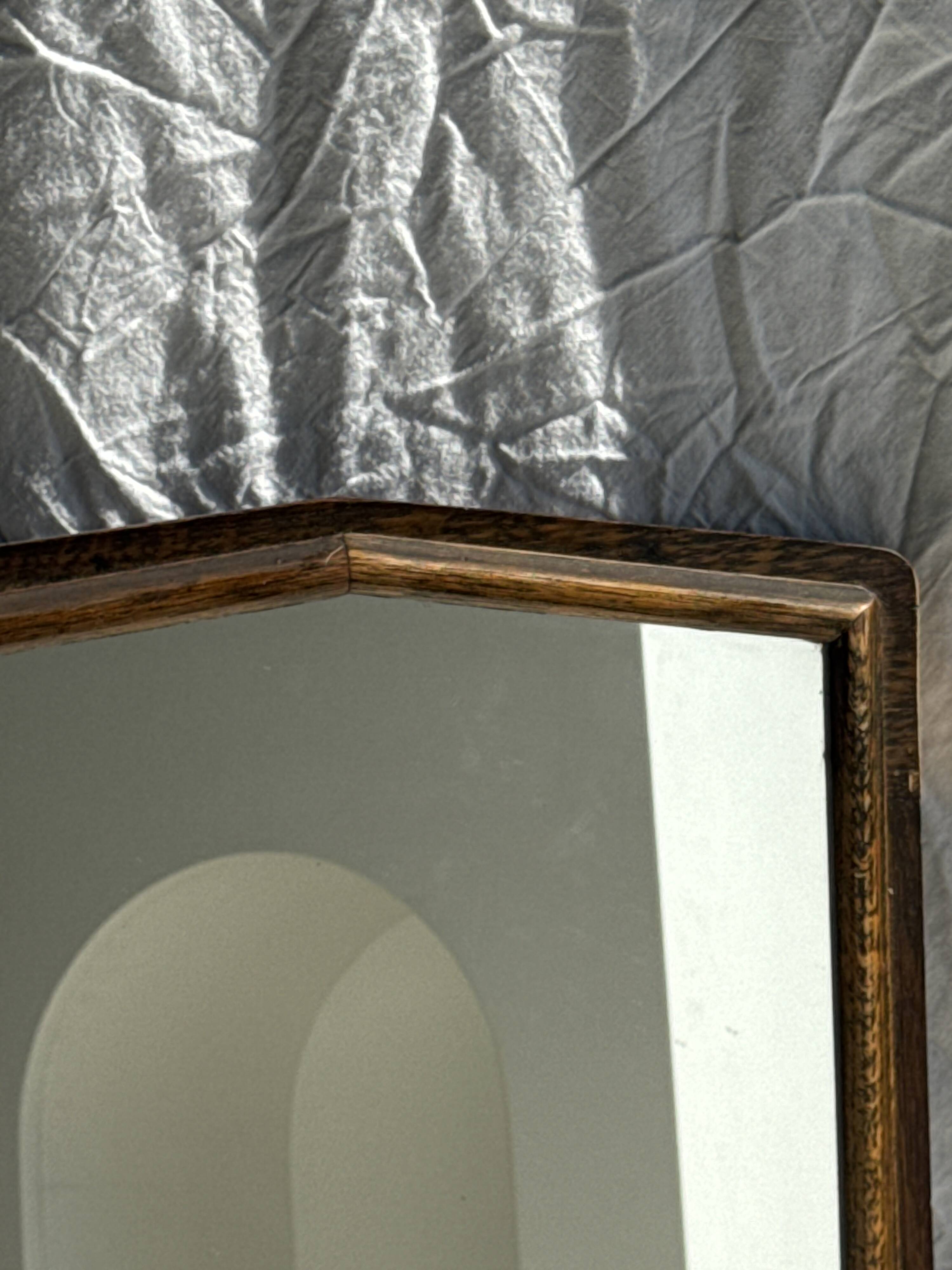 Small antique English rectangular mirror with pediment and oak frame