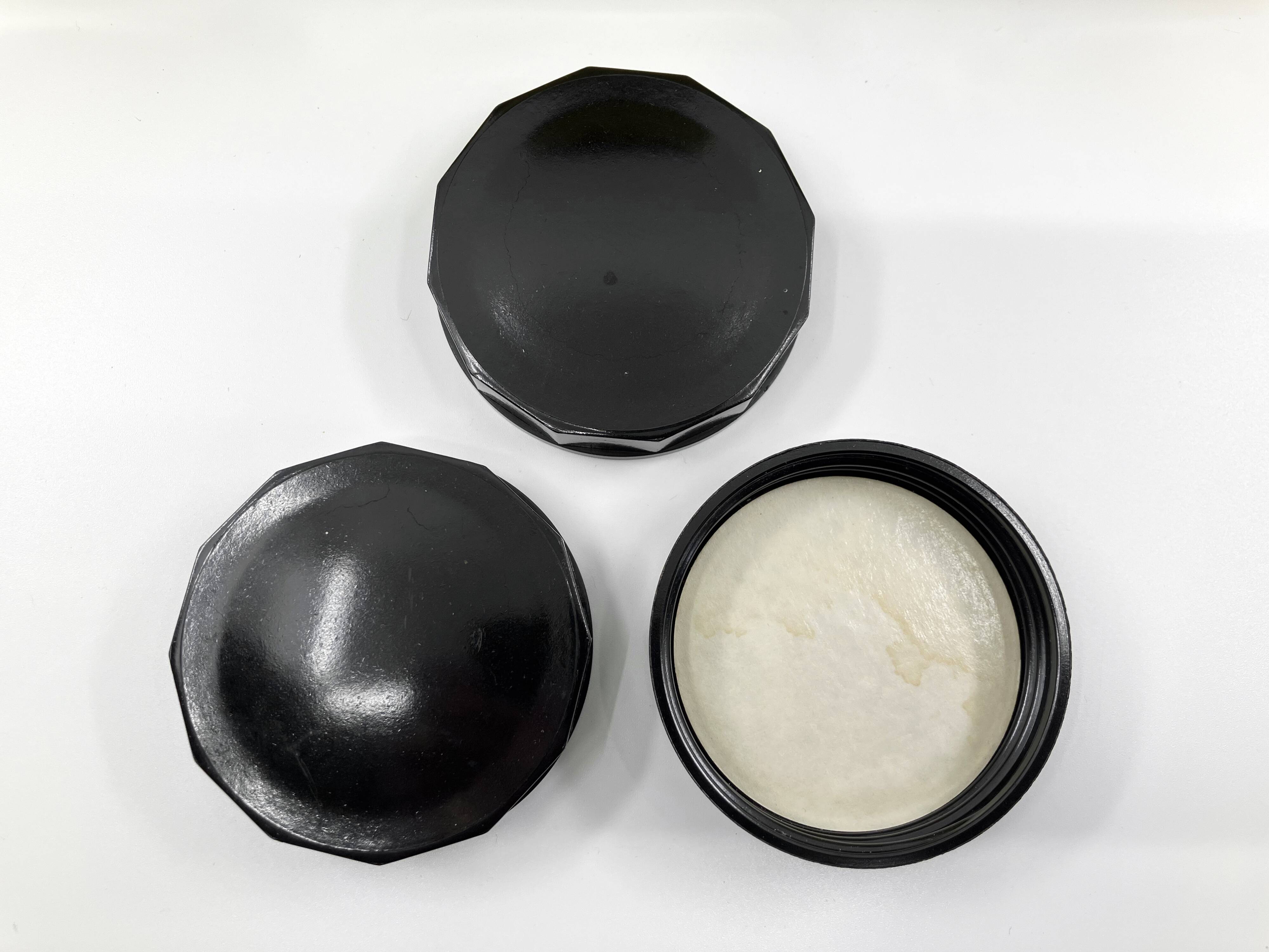 3 molded amber glass pharmacy bottles • Bakelite stoppers • 1950