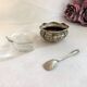 Silver metal salter and glass with salt shovel