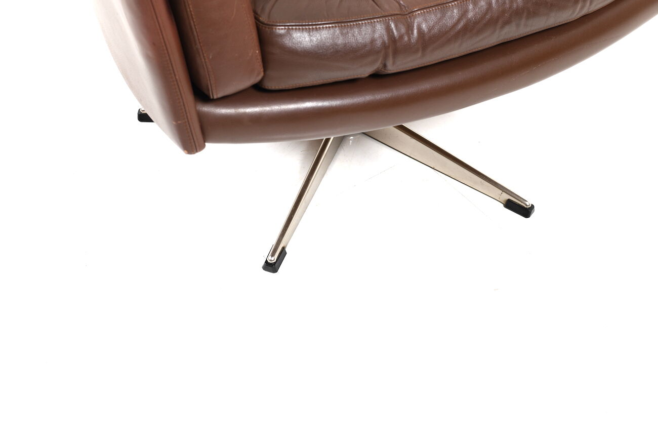 Danish swivel lounge chair in brown leather