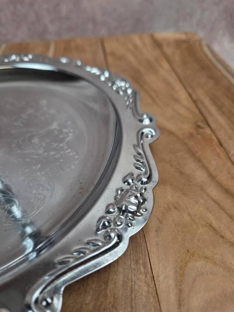 Small vintage round display stand in chrome metal – rococo style