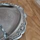 Small vintage round display stand in chrome metal – rococo style