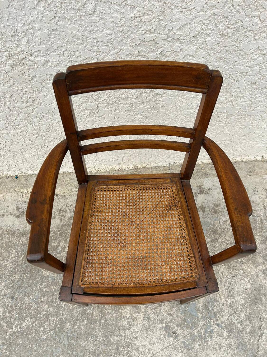 Cane armchair with armrests