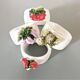 Lot de 4 ronds de serviette en barbotine.