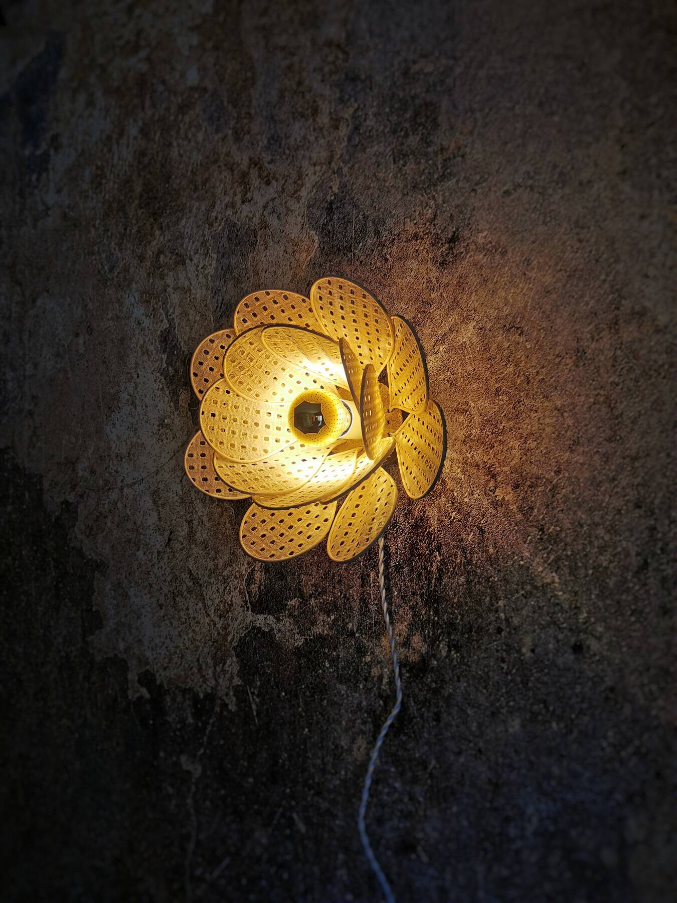 Flower wall light made of rattan petals and nude embroidery