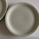 Set of 7 Scandinavian modernist flat plates in ivory earthenware