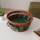 Vintage wicker and rattan basket with tartan fabric.