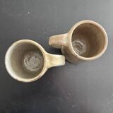 Pair of signed stoneware mugs