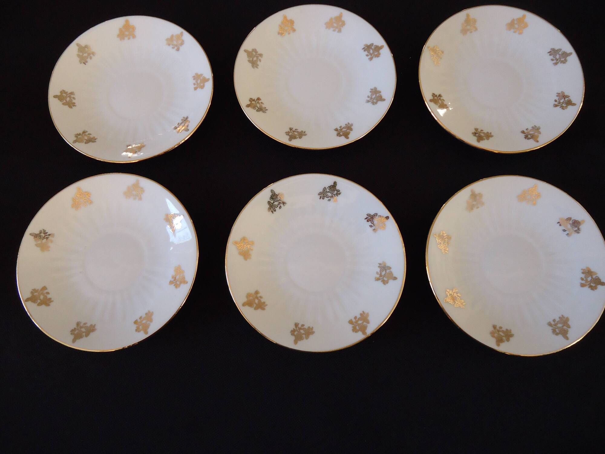 Set of six Art Deco white fine porcelain coffee cups and saucers