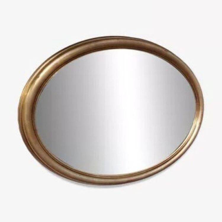 Grand et élégant miroir doré ovale avec sa glace biseauté