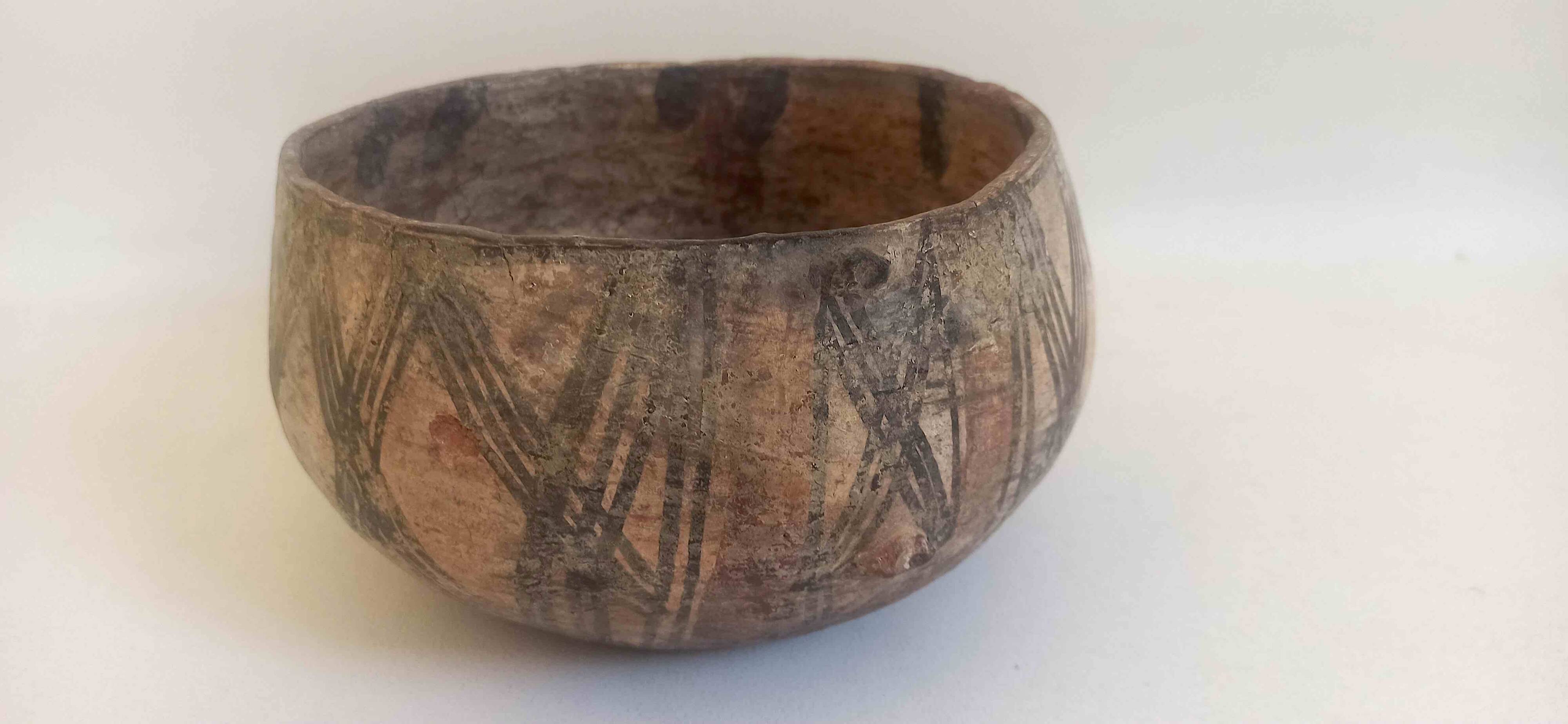 Large ethnic style bowl in orange terracotta, early 20th century