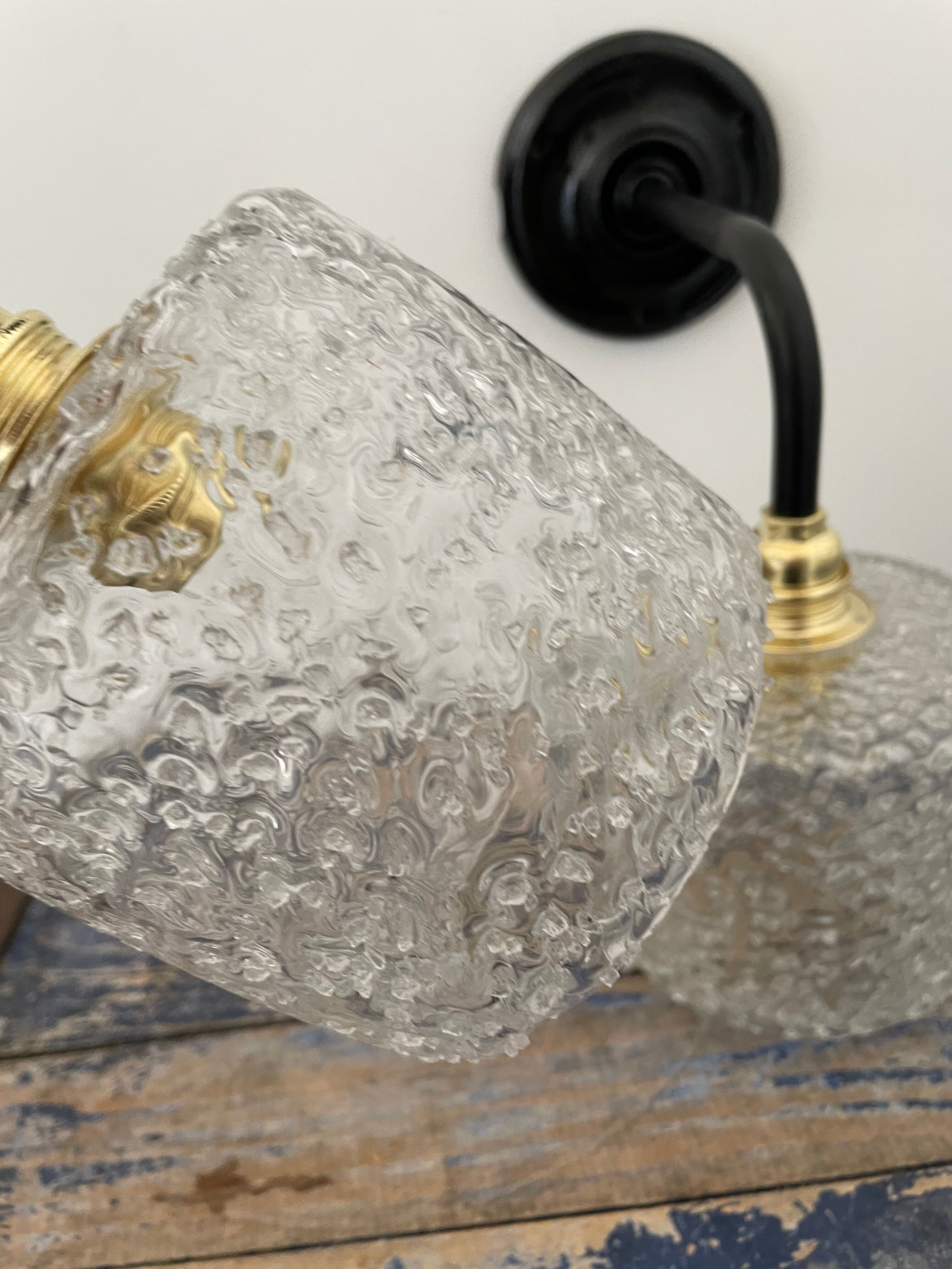 Set of two chiseled glass sconces