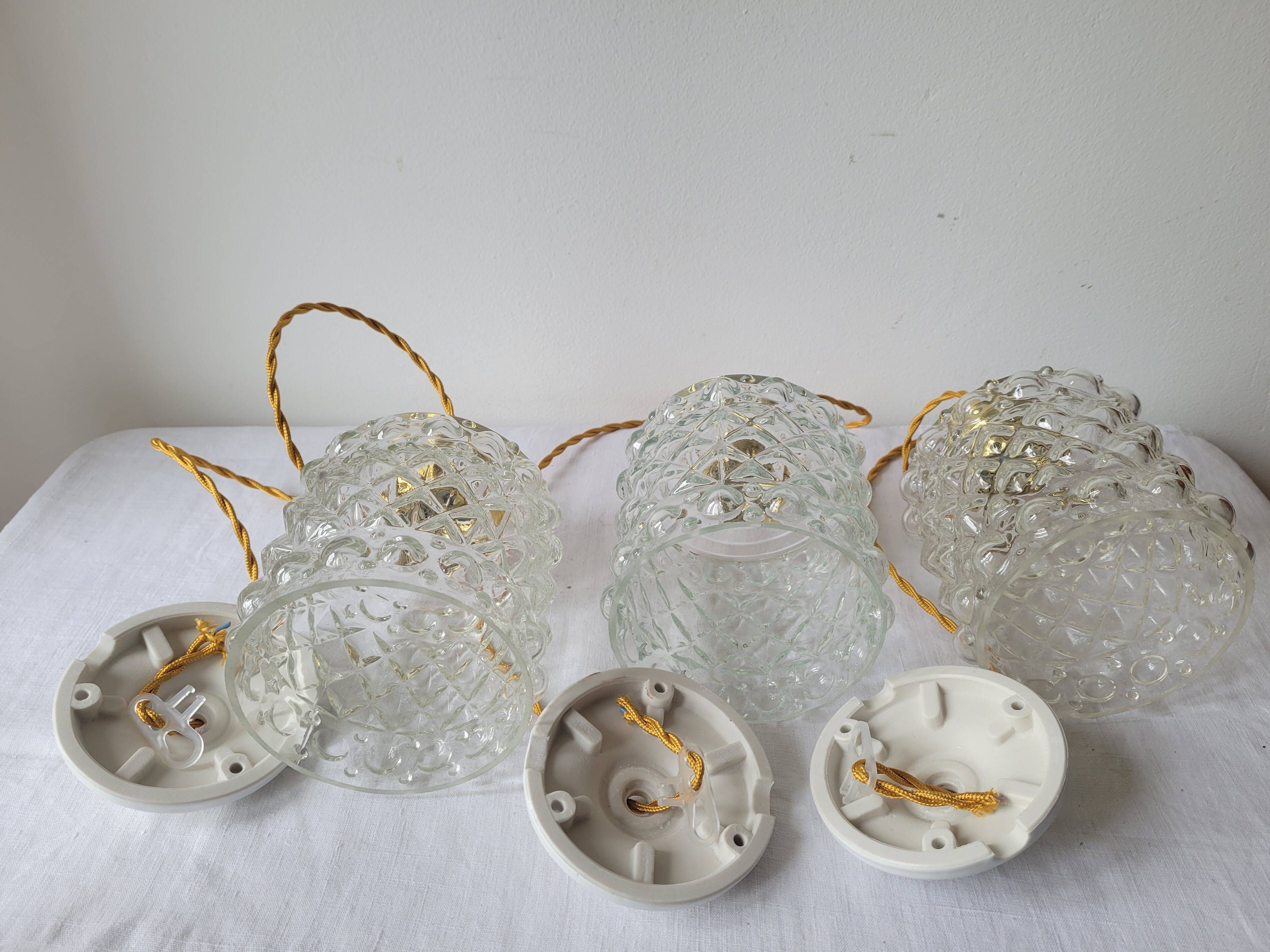 Trio of molded glass pendant lights