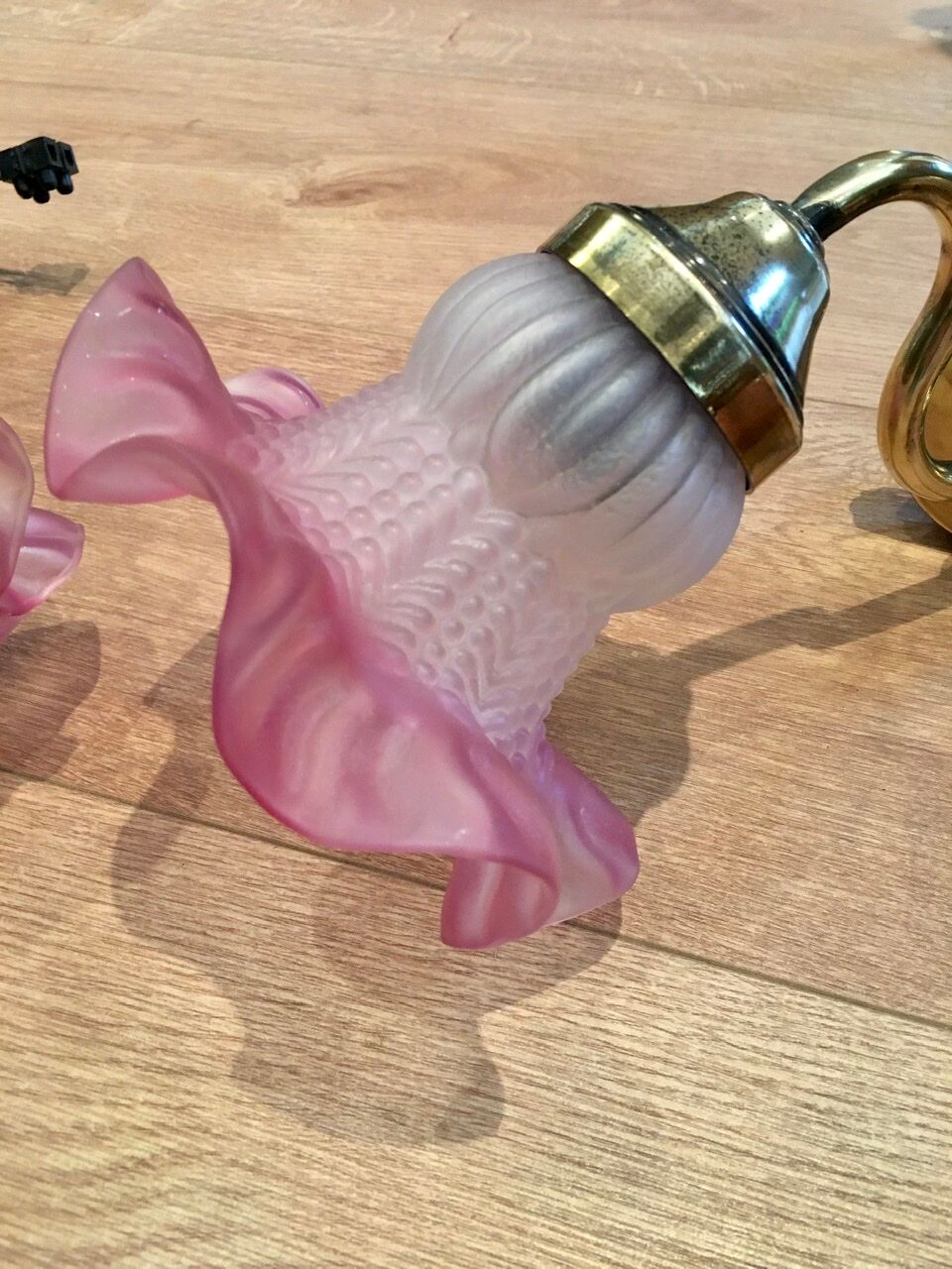 Pair of brass sconces and pink glass