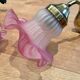 Pair of brass sconces and pink glass