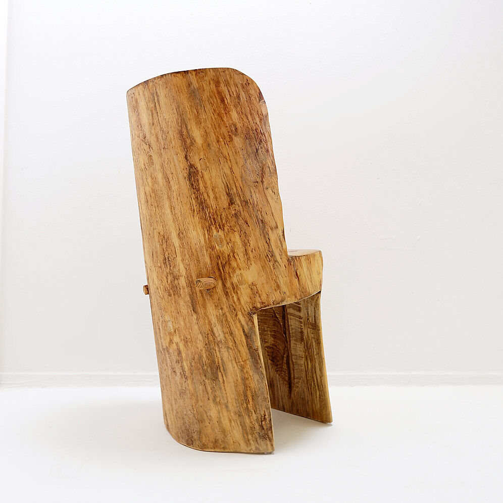 Brutalist sculptural chair in solid oak in wabi-sabi style.