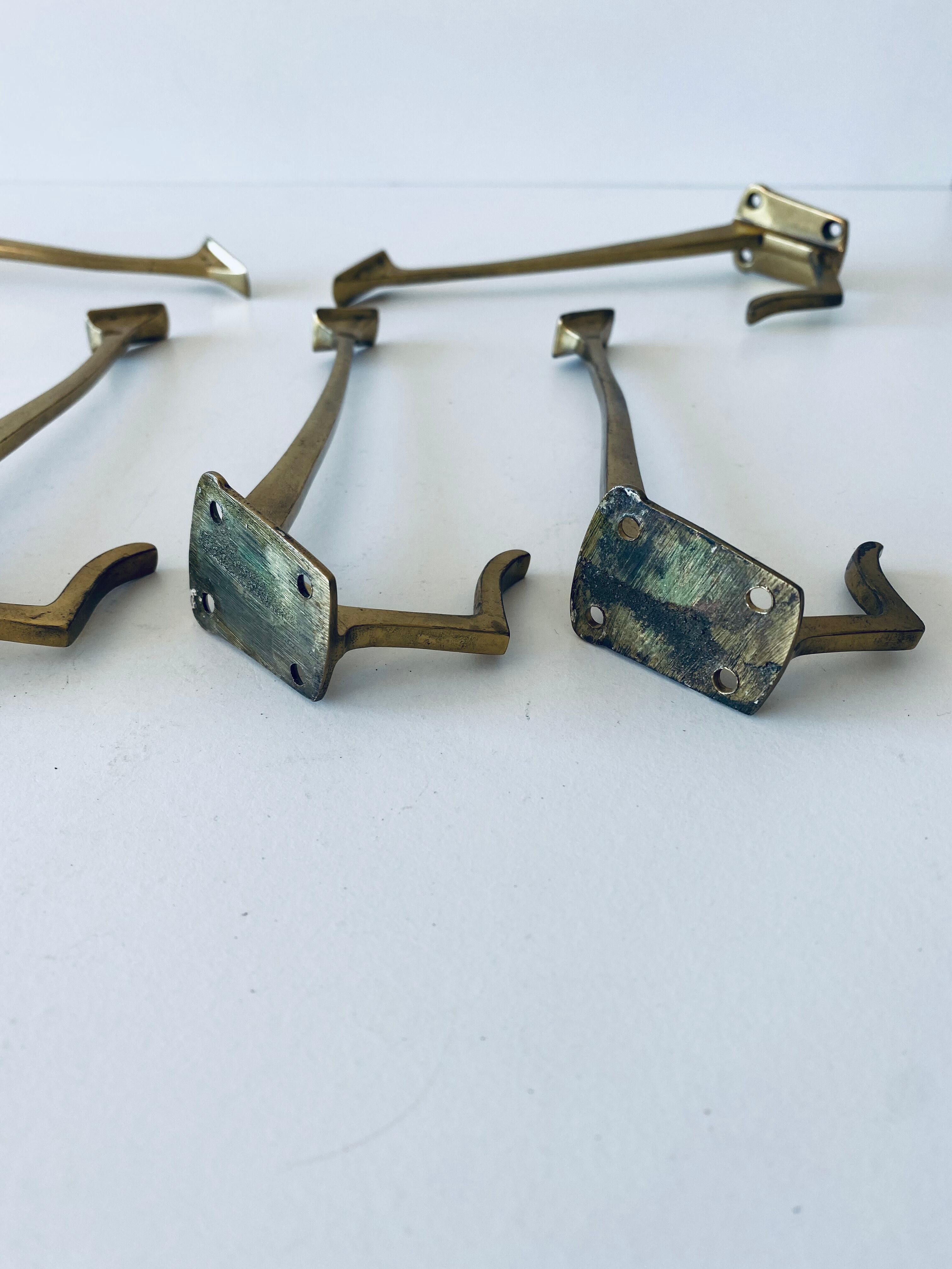 Pair of vintage brass hooks