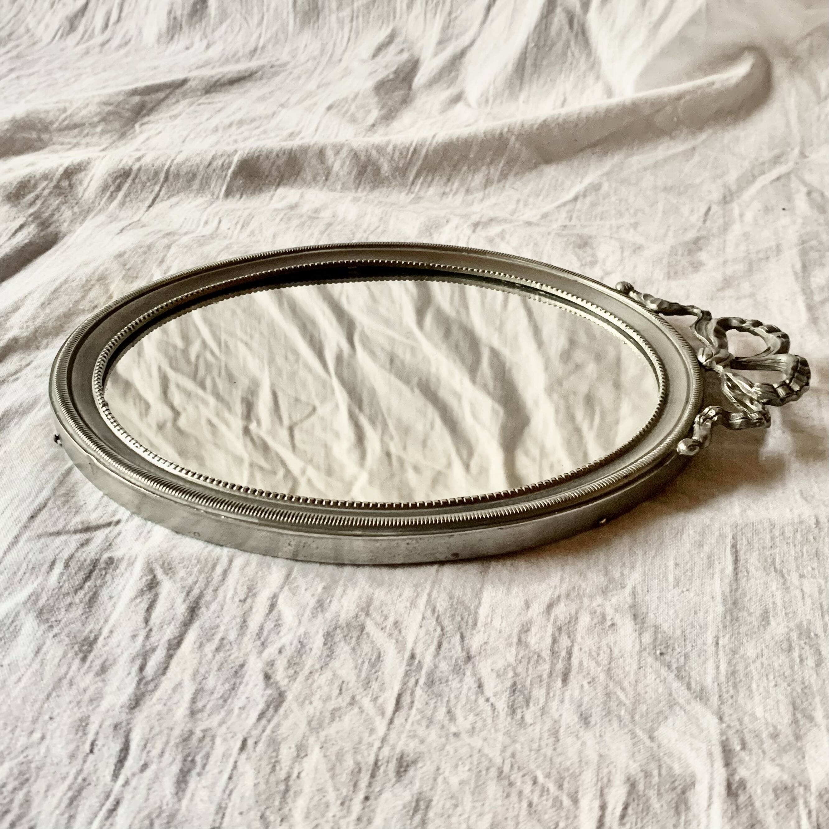 Louis XVI style oval metal wall mirror