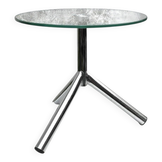 Modernist tripod side table in tempered glass and chrome metal.