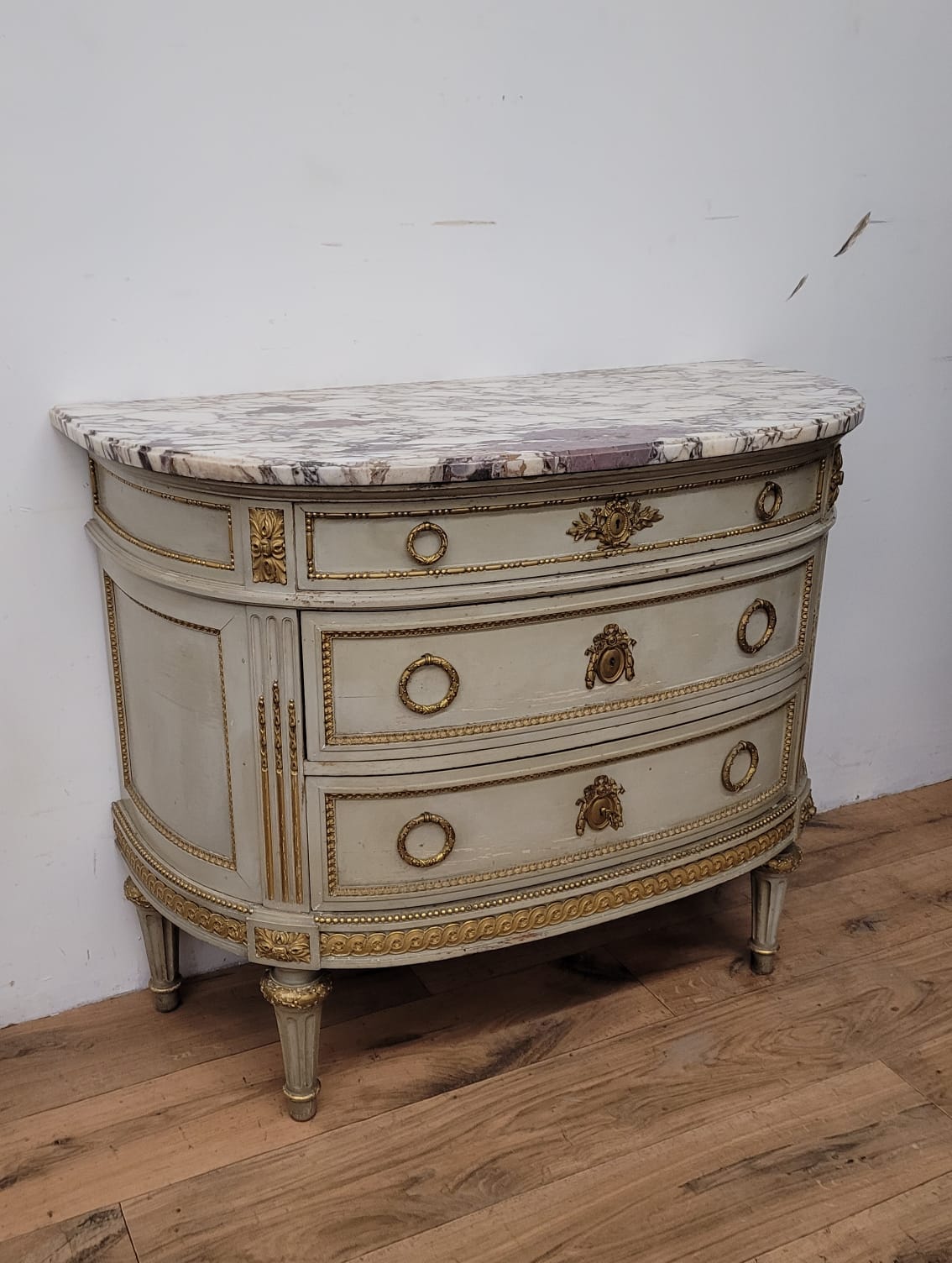 Lacquered half-moon chest of drawers with marble top