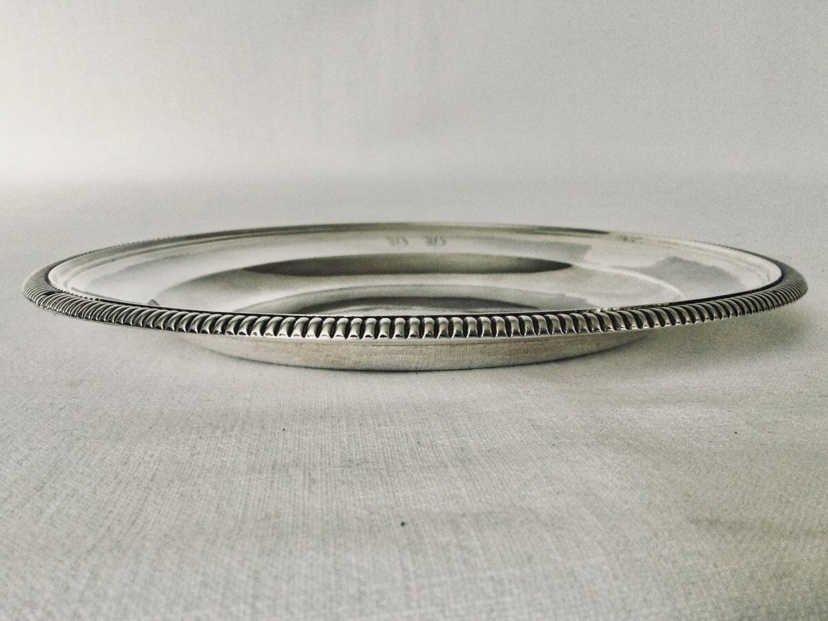 Solid silver dish with old man