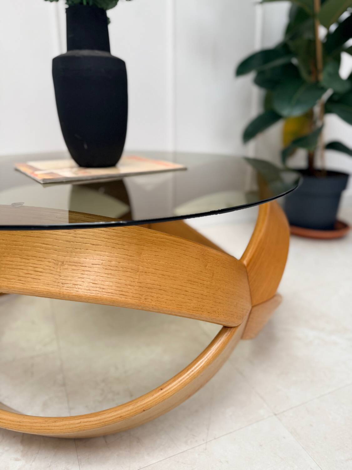 Smoked glass and curved wood coffee table