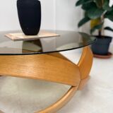 Smoked glass and curved wood coffee table