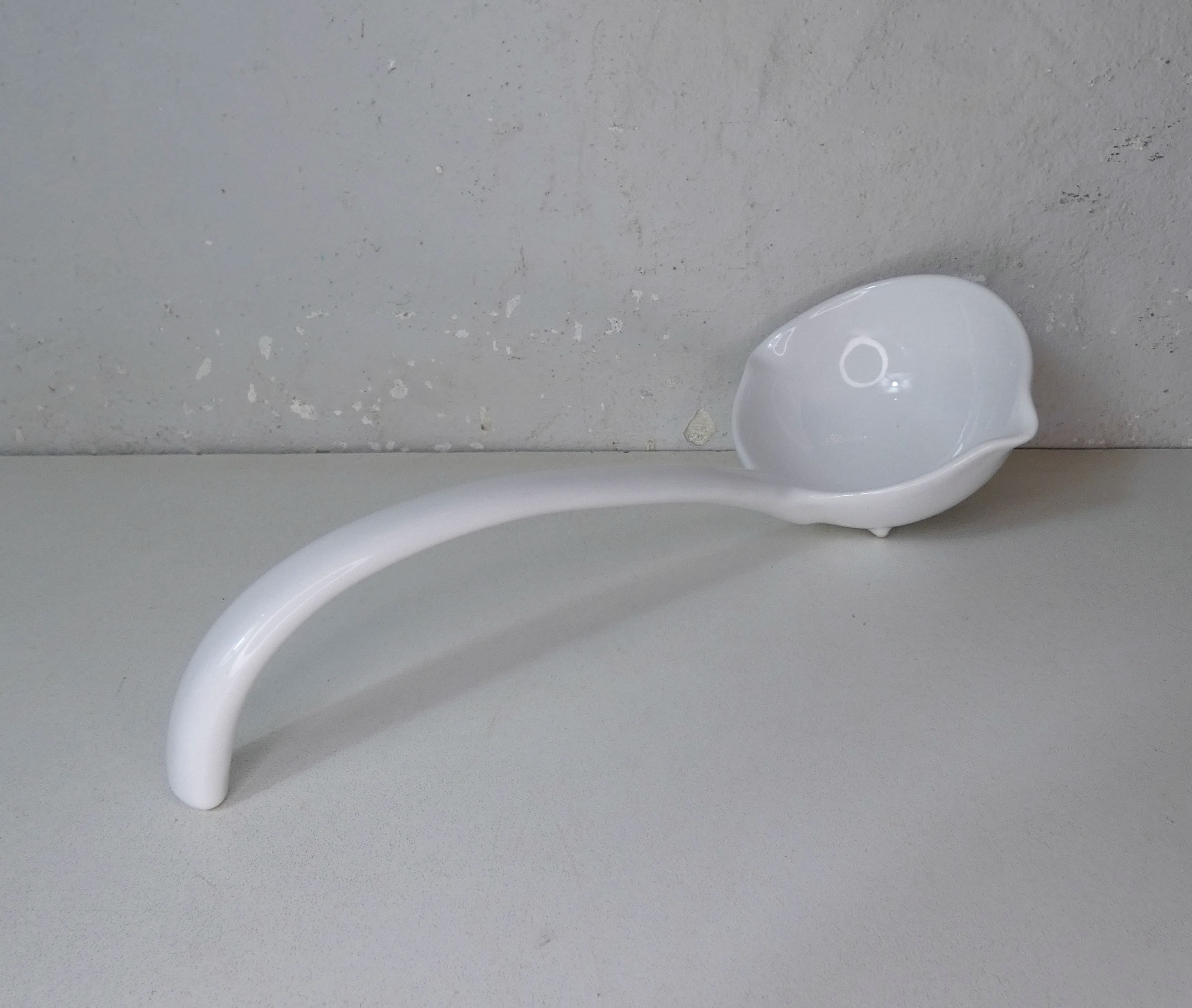 White ceramic ladle