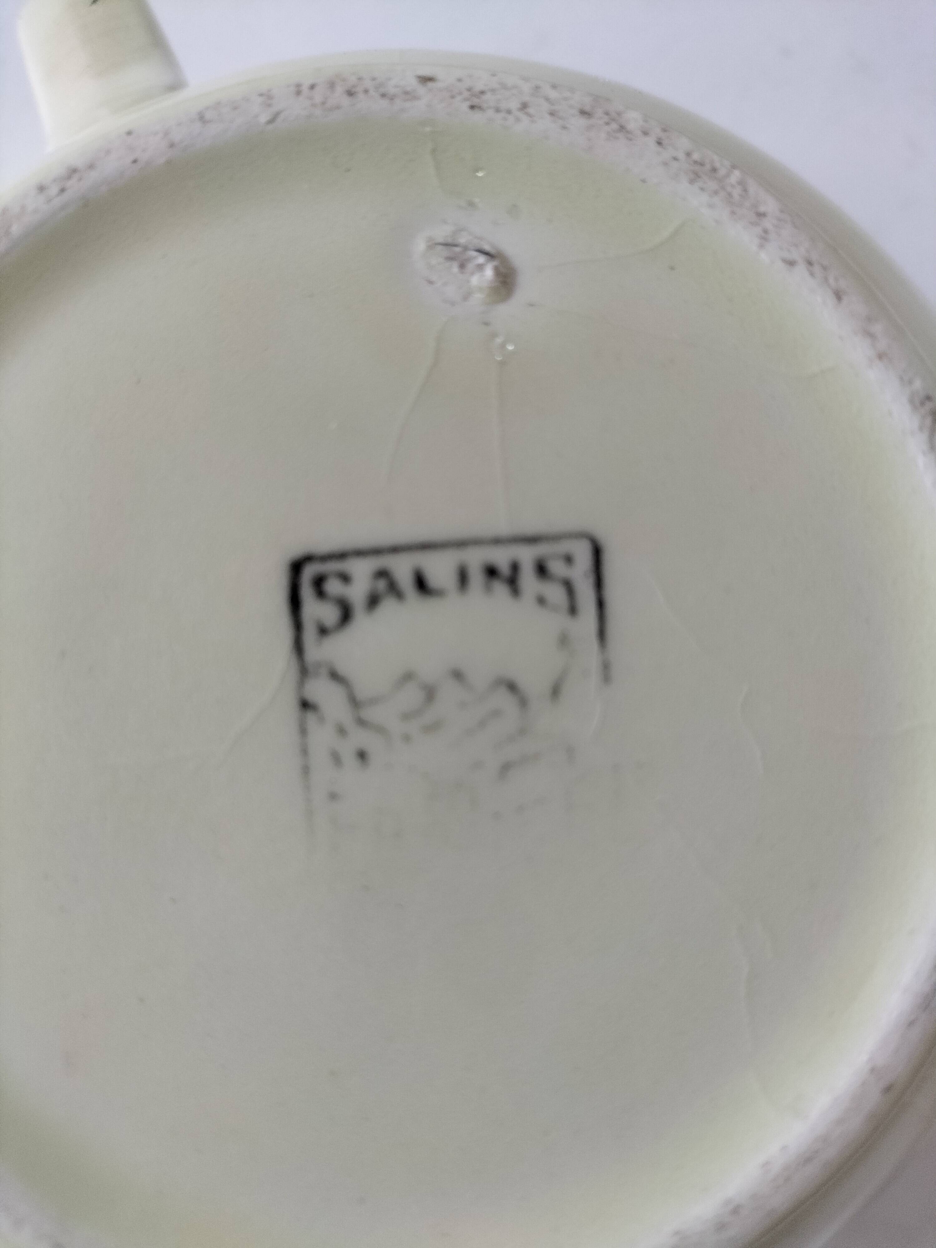 Two sugar bowls and a textured plate in turquoise and green Salins earthenware.