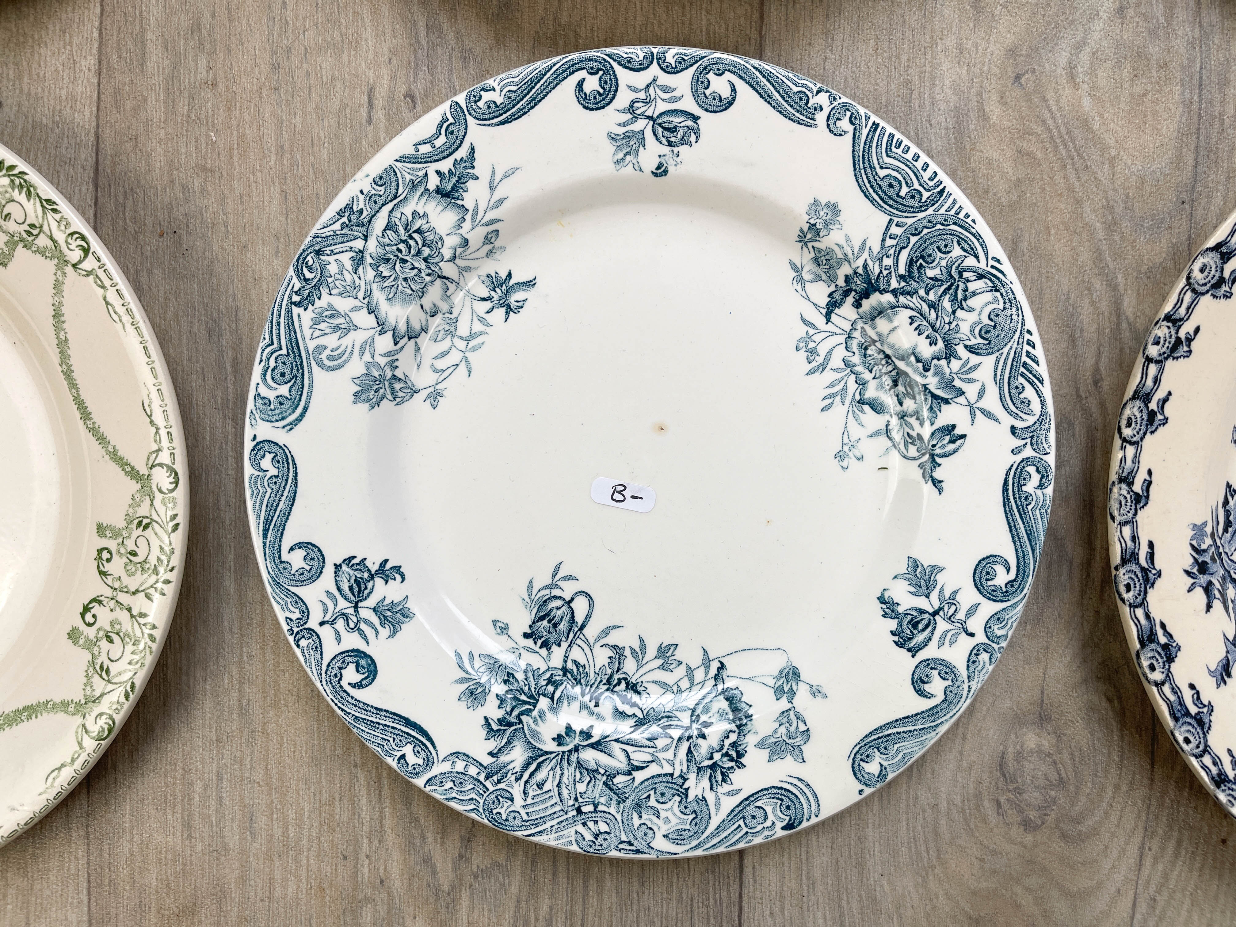 6 green and blue mismatched iron earth plates