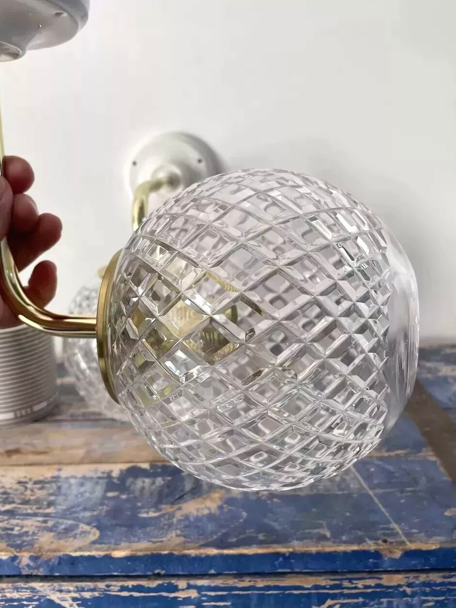 Set of two wall sconces in brass and glass